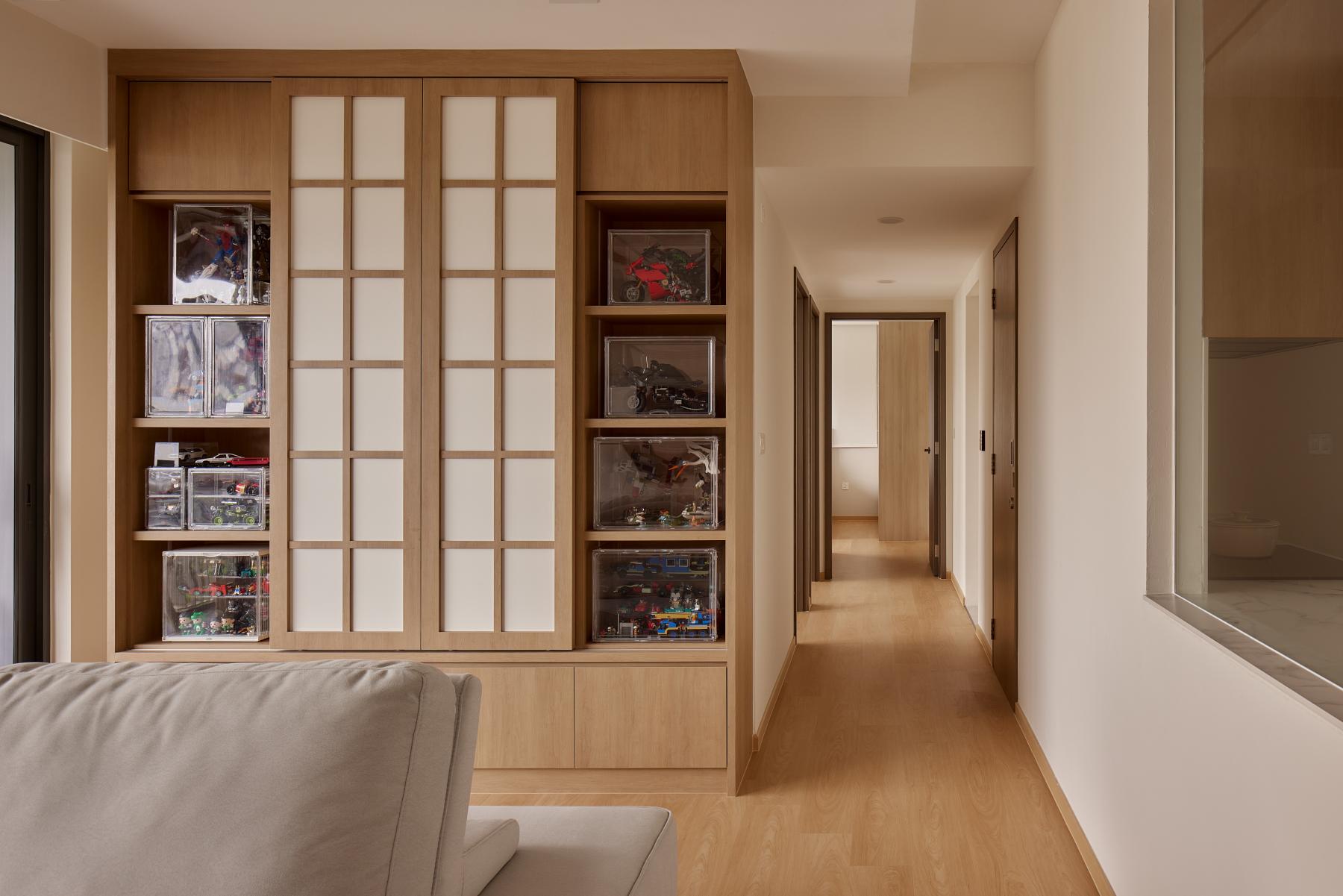 Asian Hallway with Wood Flooring and Display Cabinets