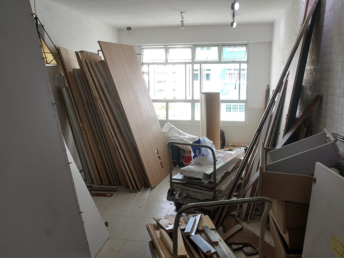 Asian Living Room with Homogeneous Tiles and TV Console