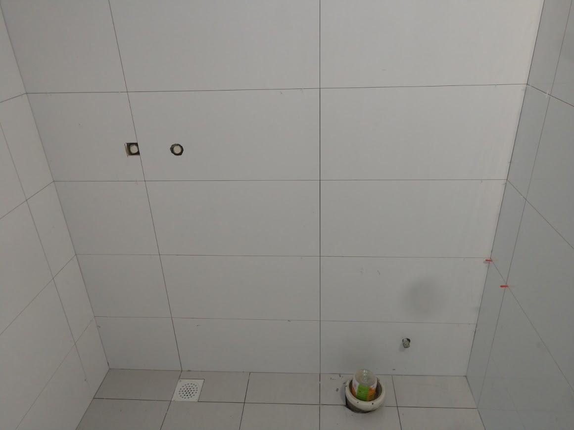 Asian Bathroom with Homogeneous Tiles and Cement Floor