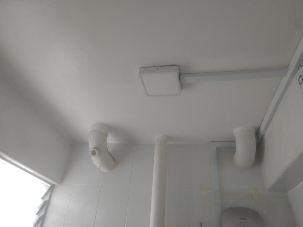 Asian Bathroom with Homogeneous Tiles and Bathroom Tap