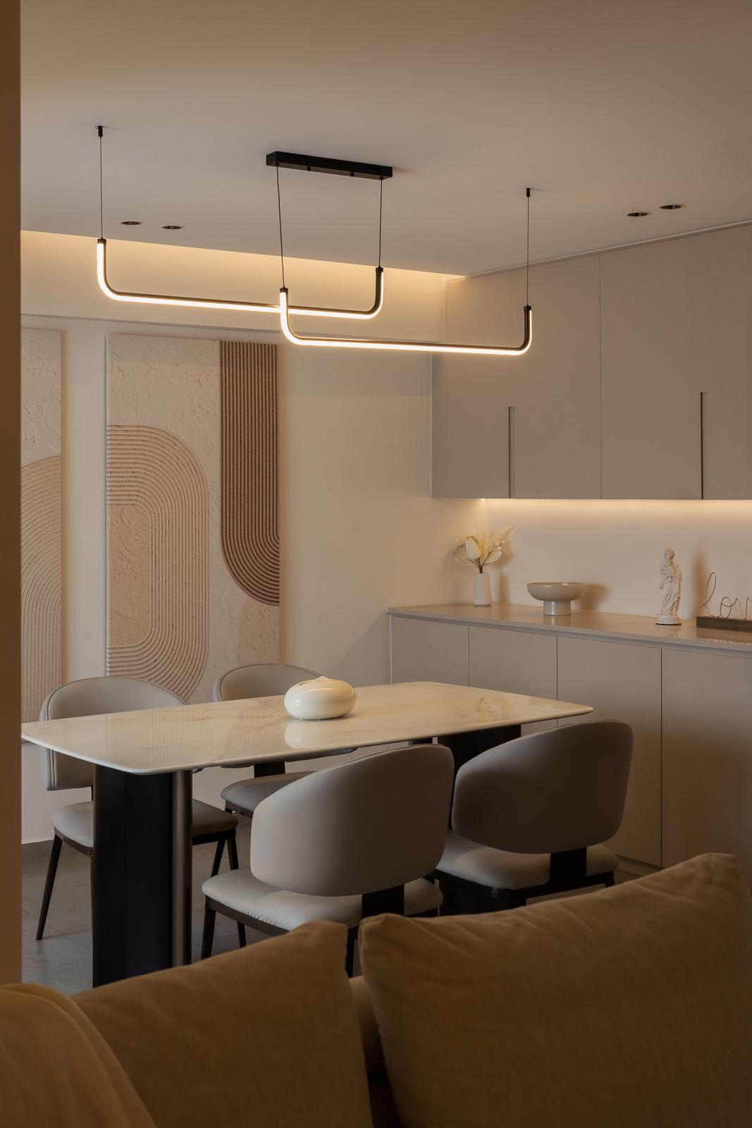 Modern Dining Room with Drop Light and Artwork