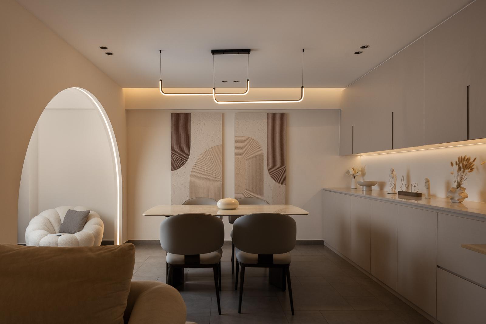 Modern Dining Room with Drop Light and Artwork