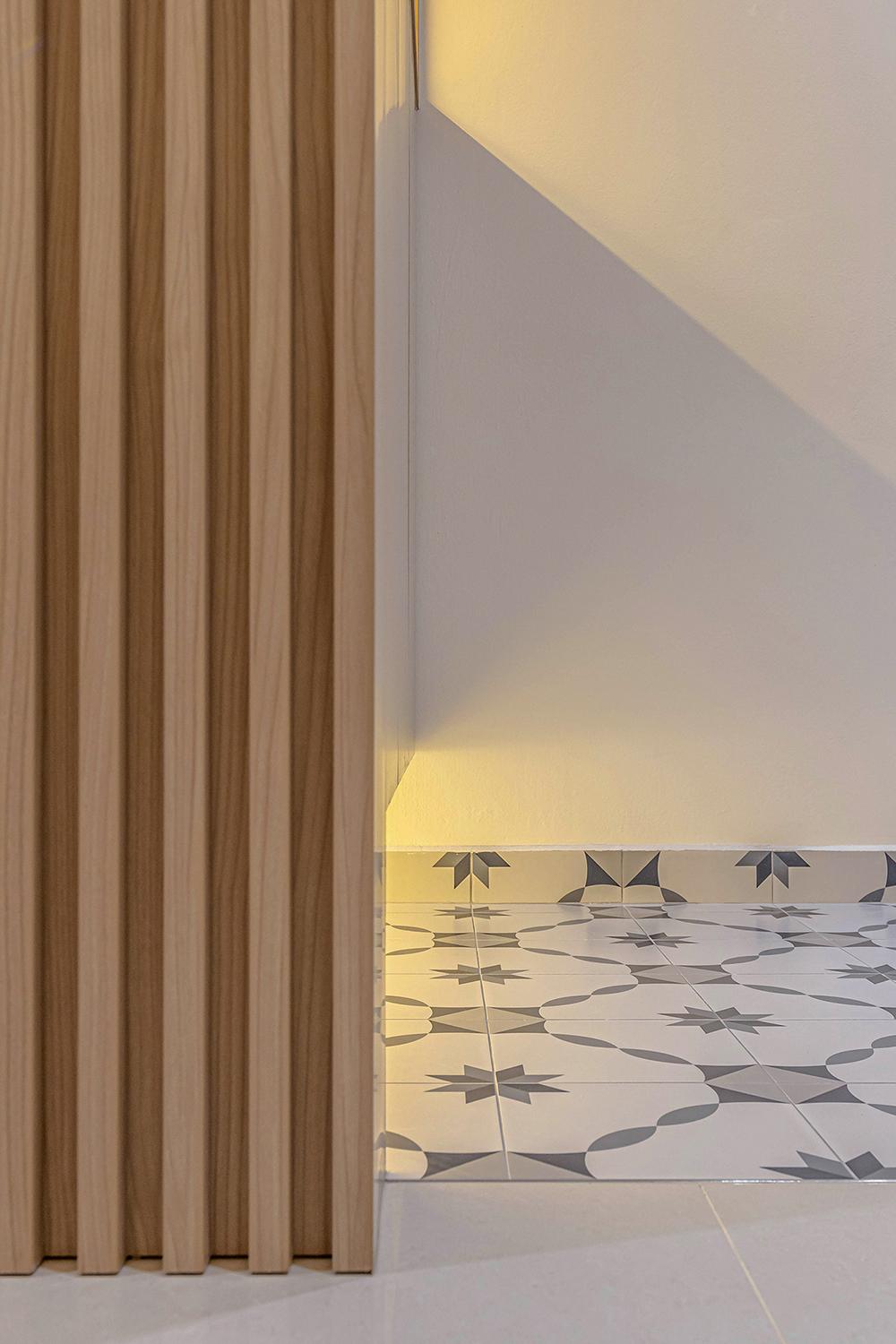 Grey Geometric Tiles with Cove Lighting
