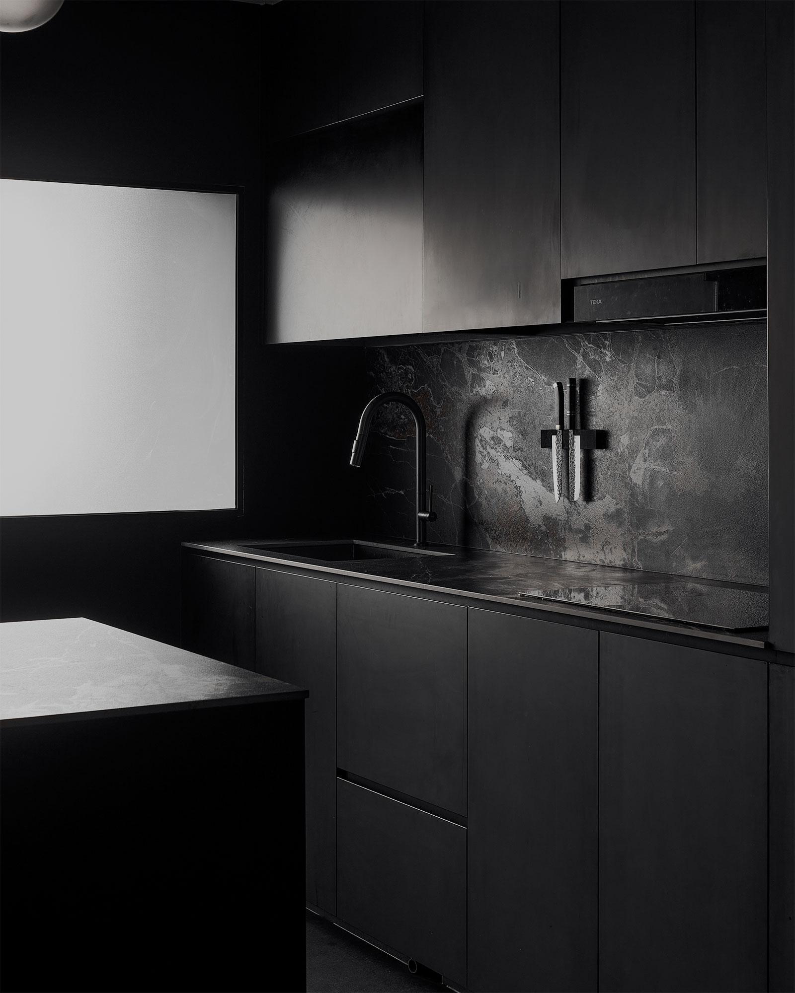 Contemporary Kitchen with Granite Floor and Breakfast Counter