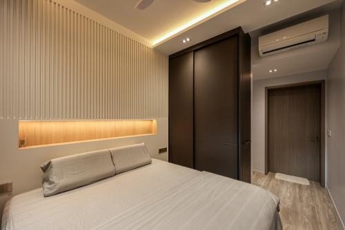 Minimalist Bedroom at Woodleigh Residences