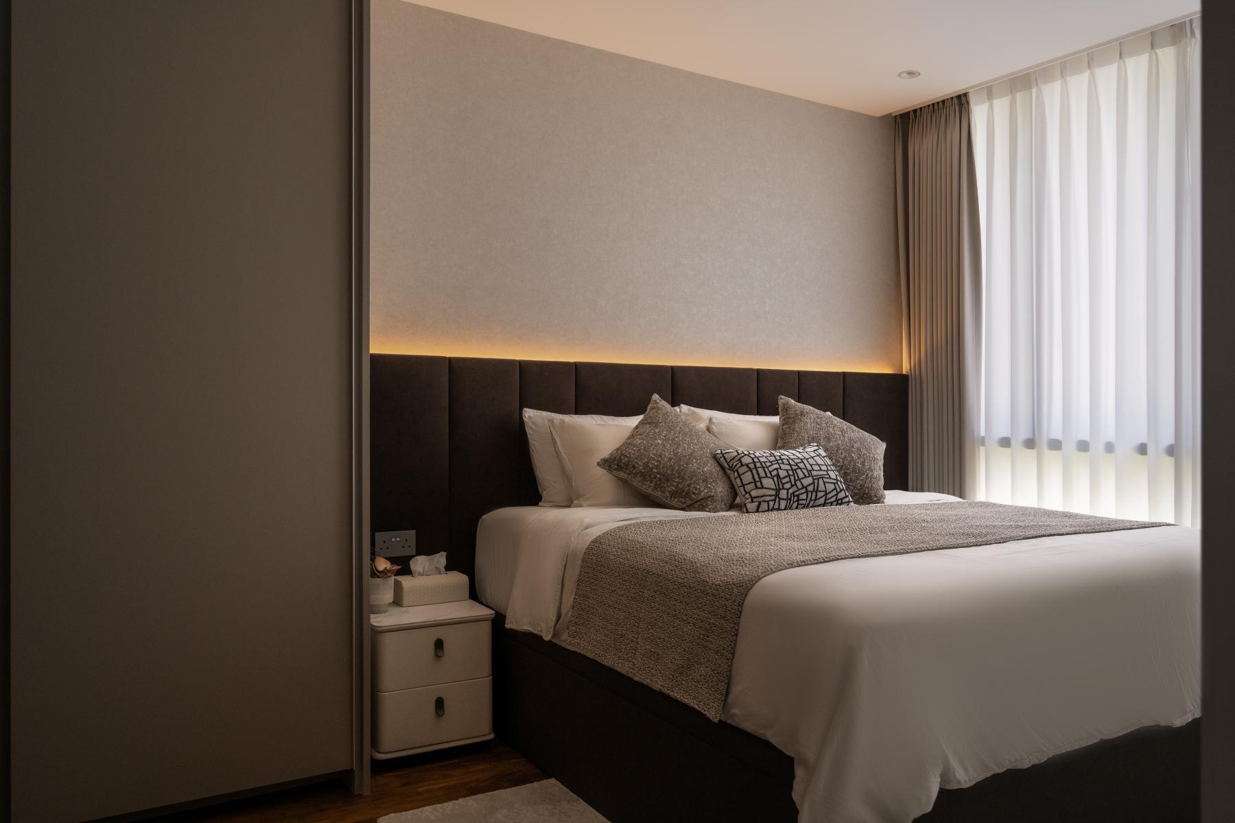 Contemporary Bedroom with Cove Lighting and Curtain