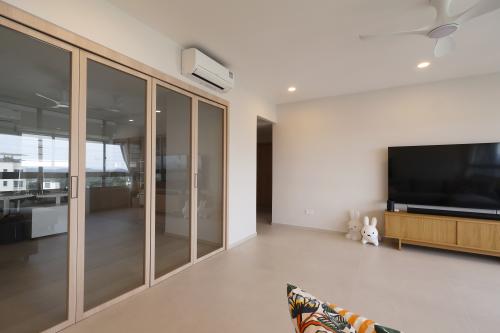 Minimalist Living Room at Resale 3 Bedroom Condo @ Mount Sinai Drive