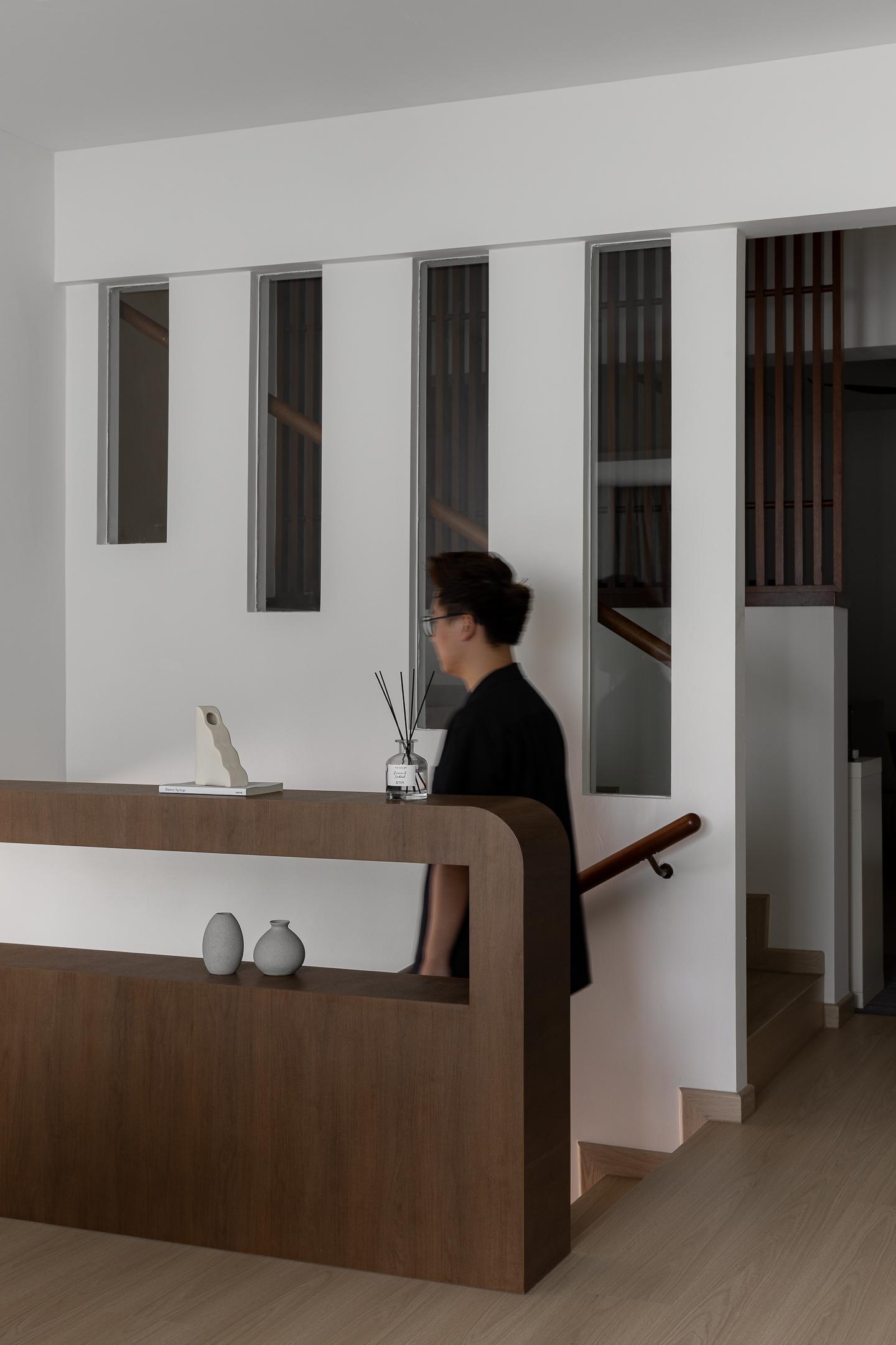 Contemporary Hallway with Bookshelf and Artwork