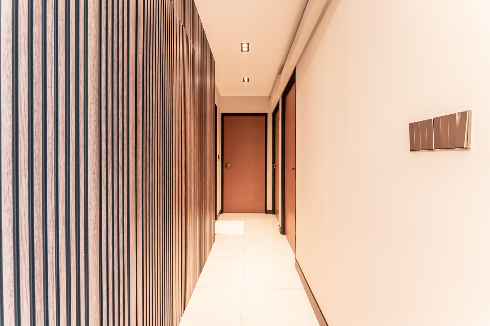 Modern Hallway with Artwork and Doors
