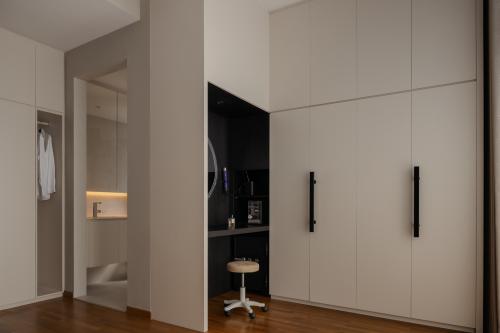 Minimalist Walk-in Wardrobe at The Skywoods