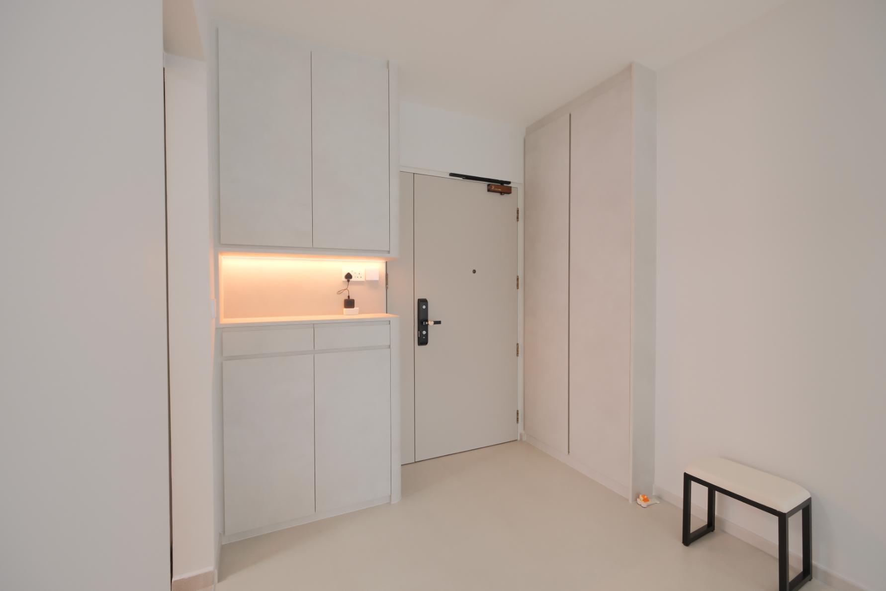Minimalist Foyer with Artwork and Shoe Rack