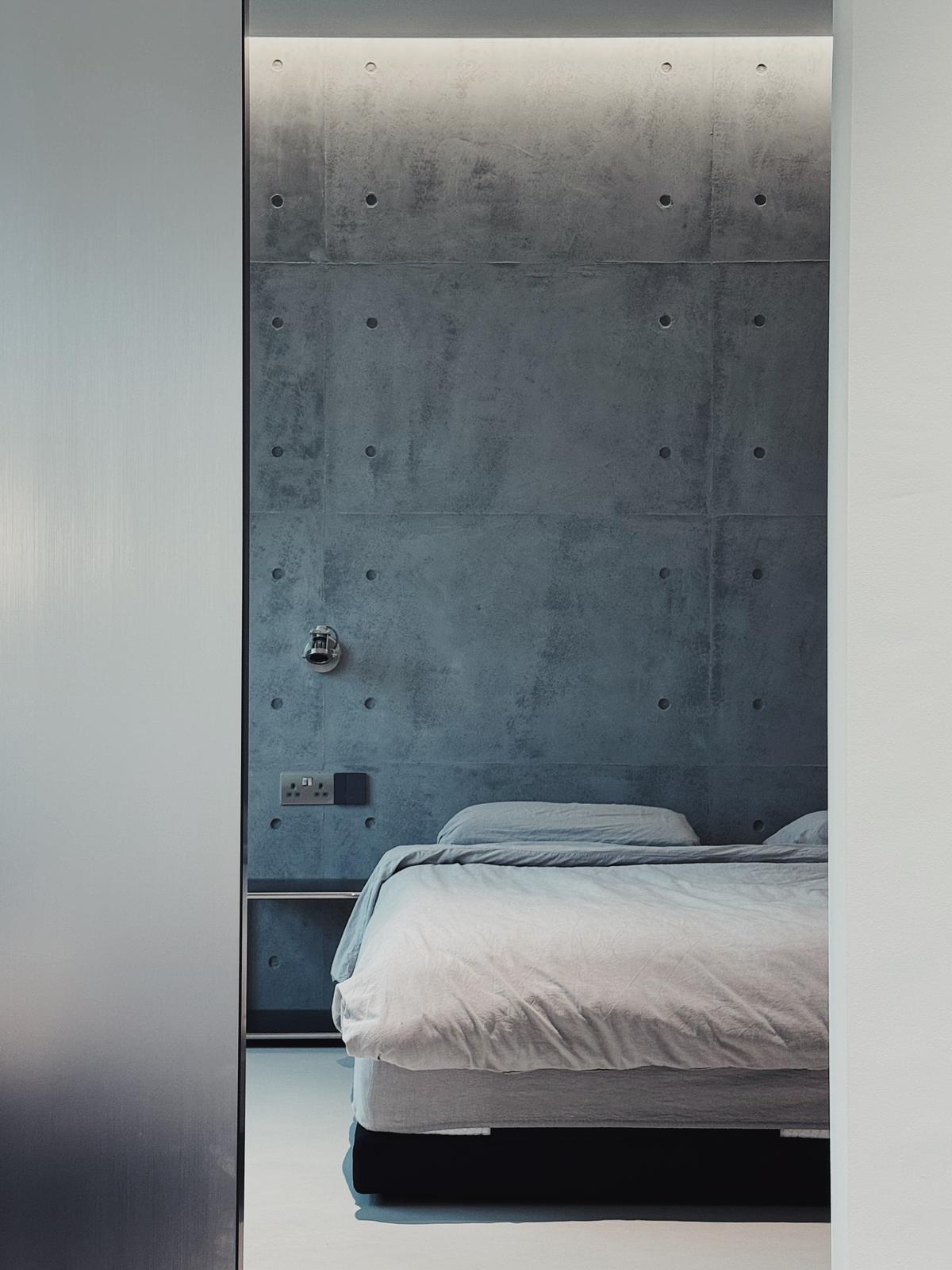 Industrial Bedroom with Feature Wall and Mirror