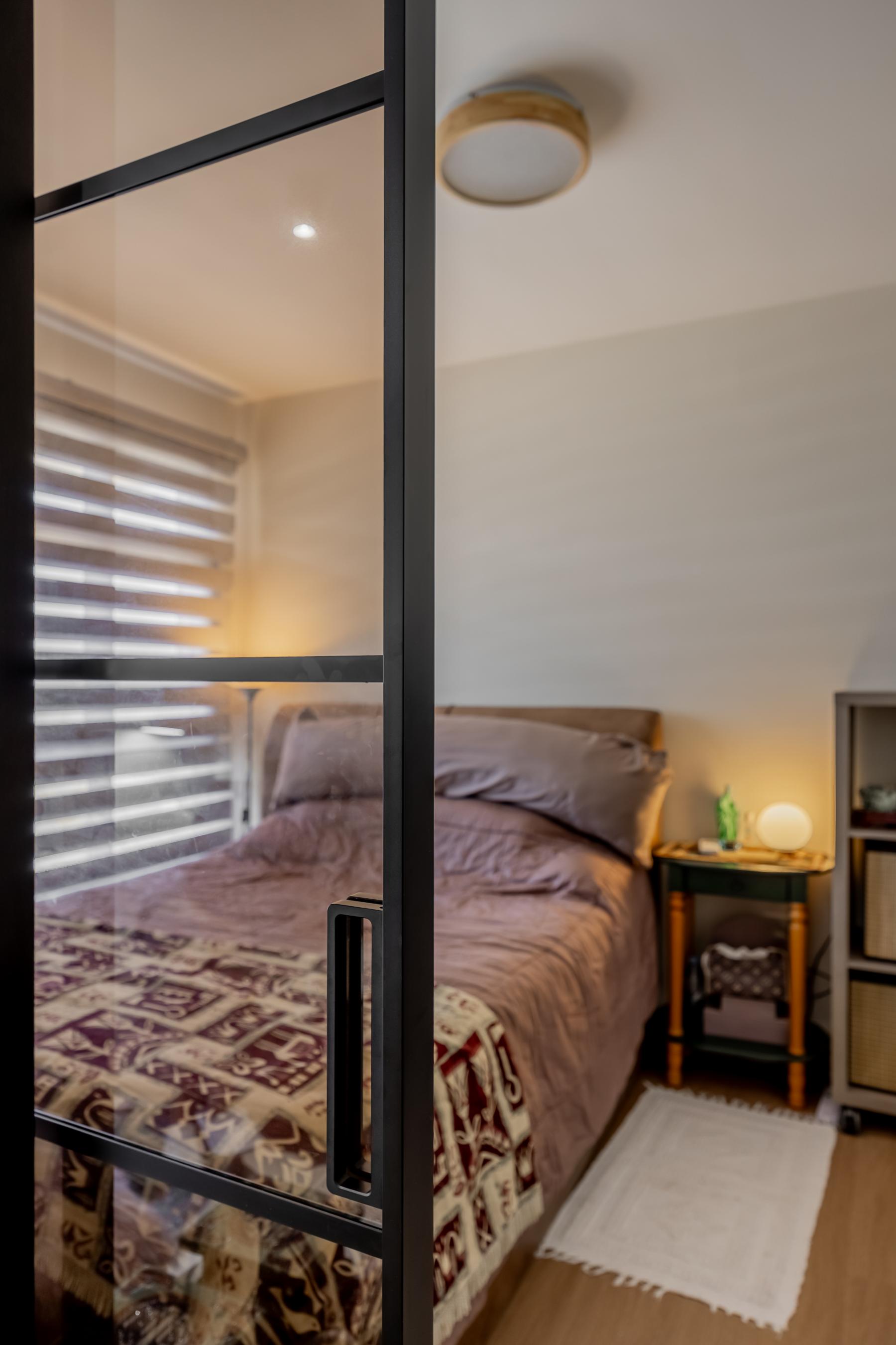 Contemporary Bedroom with Bookshelf and Vinyl Flooring