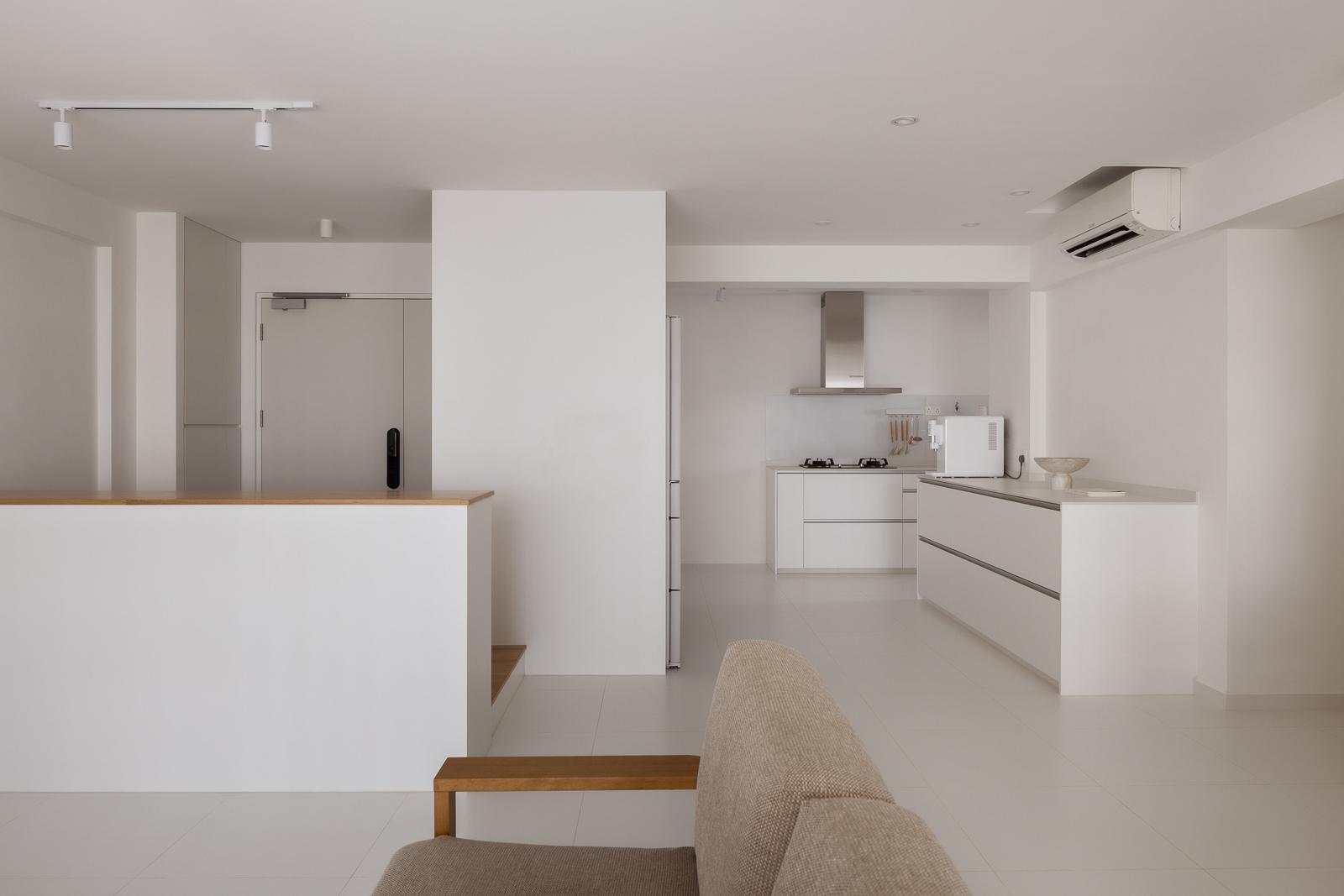 Minimalist Kitchen with Homogeneous Tiles and Cupboard