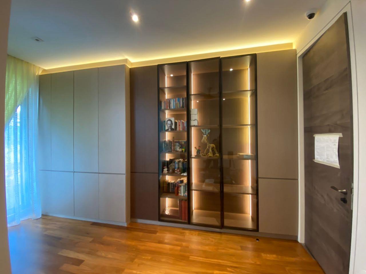 Contemporary Bedroom with Bookshelf and Wood Flooring