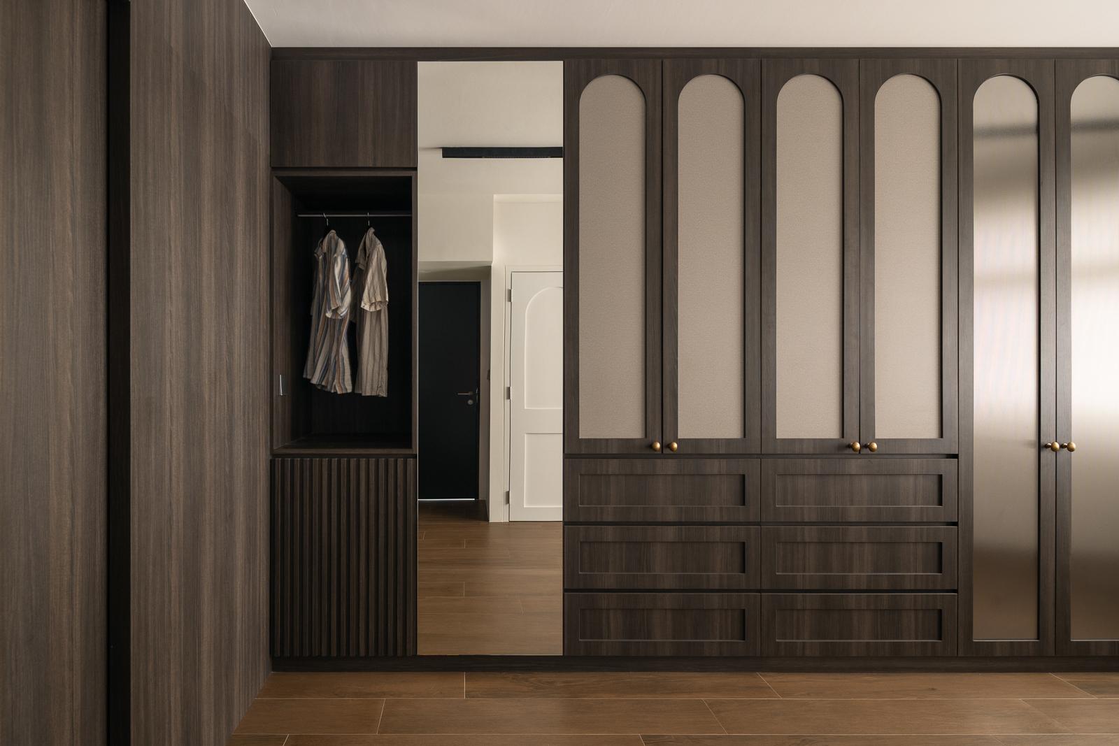 Contemporary Walk-in Wardrobe with Wood Flooring and Mirror