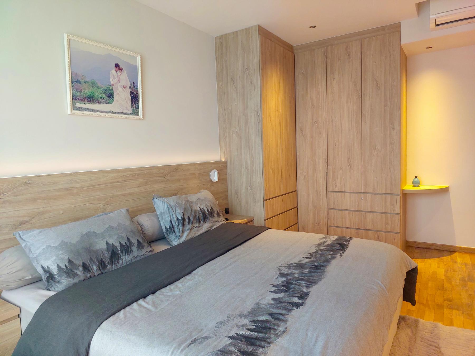 Modern Bedroom with Parquet Floor and Cove Lighting