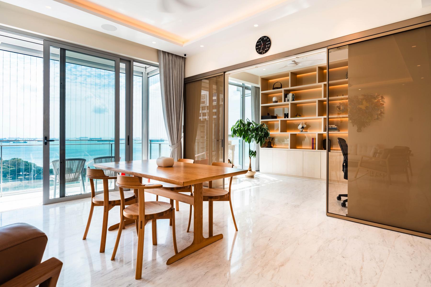 Minimalist Home Office with Bookshelf and Desk Chairs