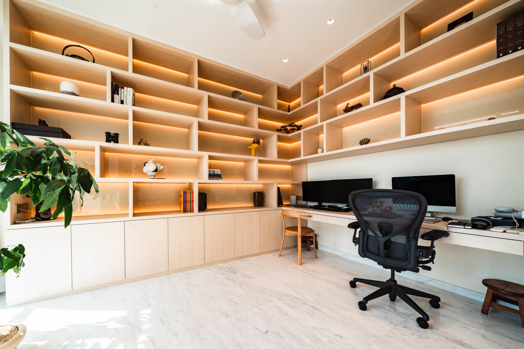Minimalist Home Office with Bookshelf and Desk Chairs