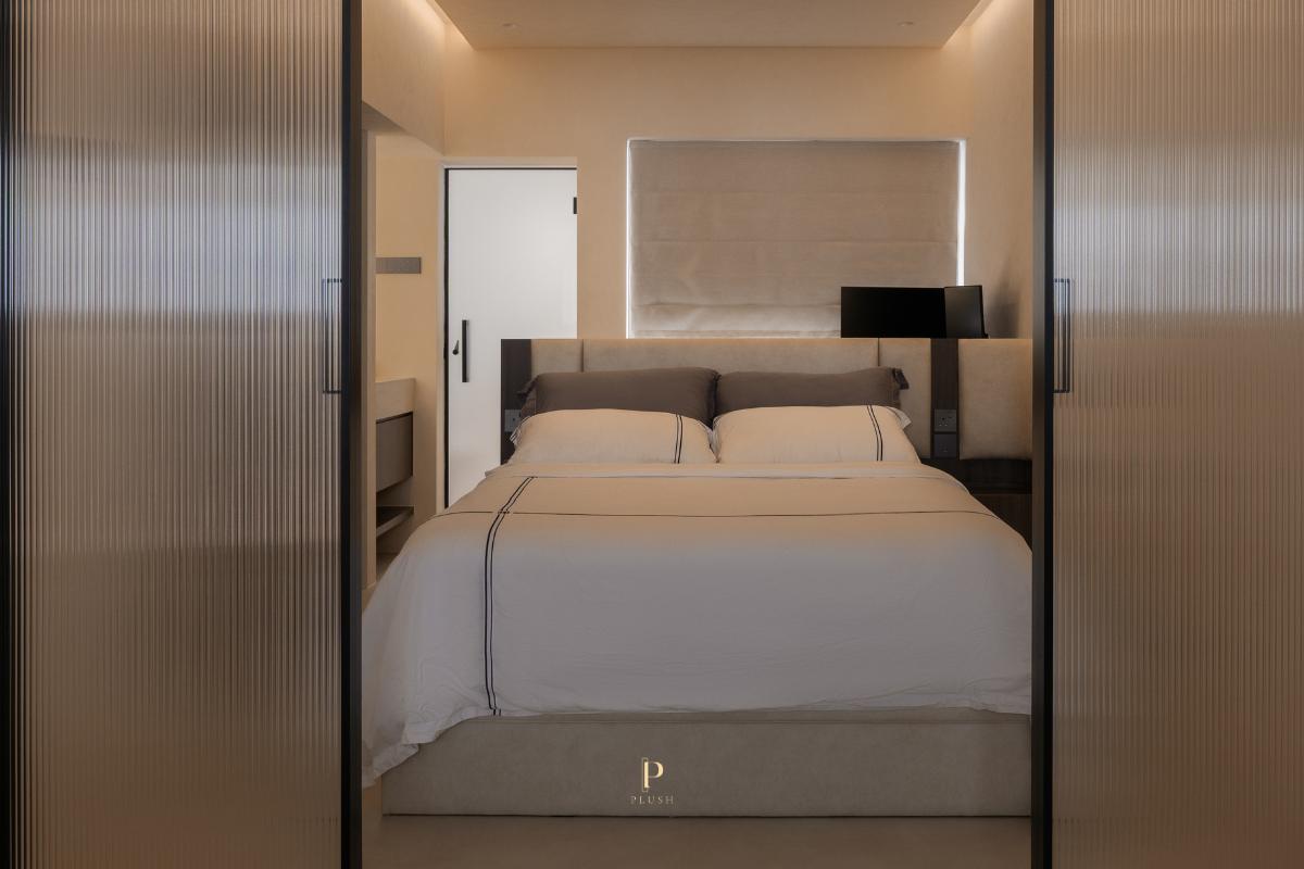 Minimalist Bedroom with Cove Lighting and Built-in Bed