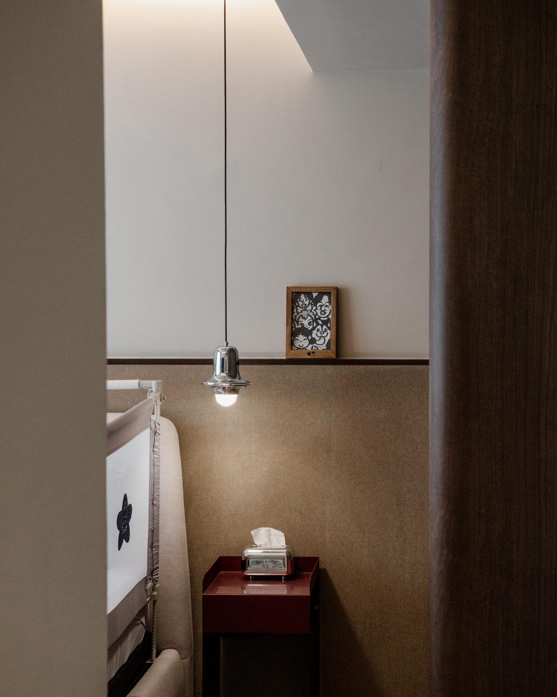 Contemporary Bedroom with Cove Lighting and Bedside Table