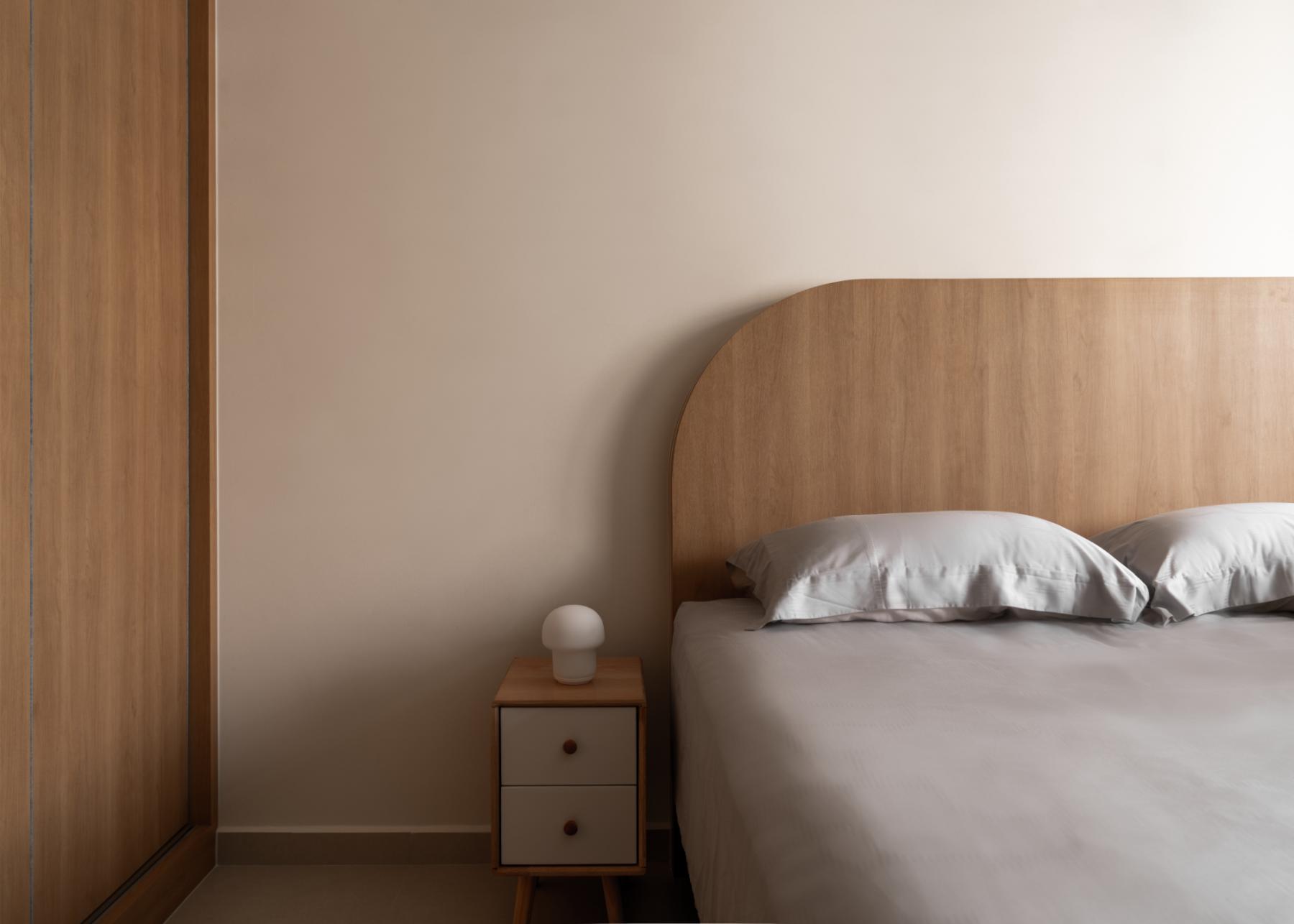 Scandinavian Bedroom with Wood Flooring and Bedside Table