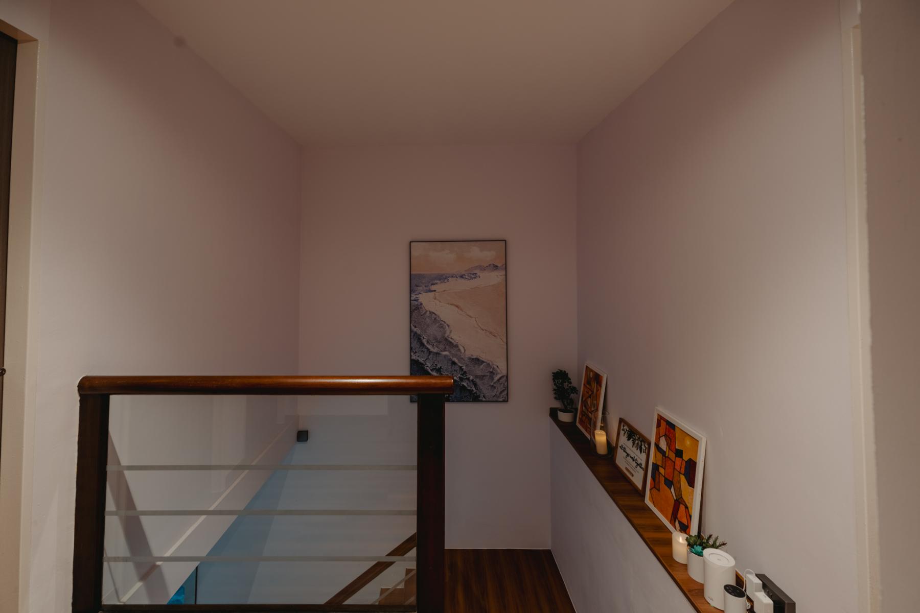 Scandinavian Hallway with Bookshelf and Artwork