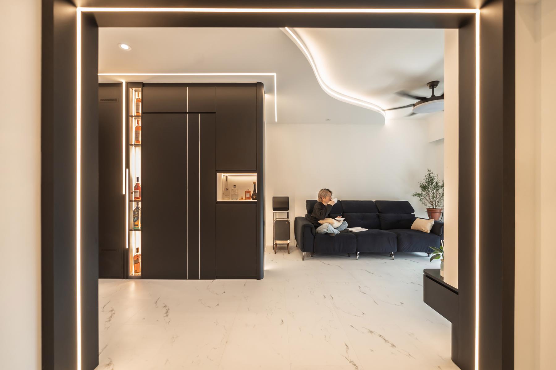 Modern Living Room with Bookshelf and Cove Lighting