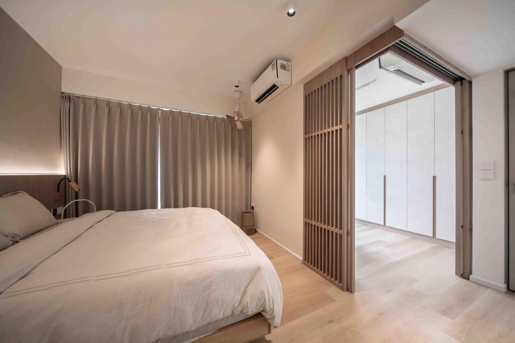 Asian Bedroom with Wood Flooring and Sideboard