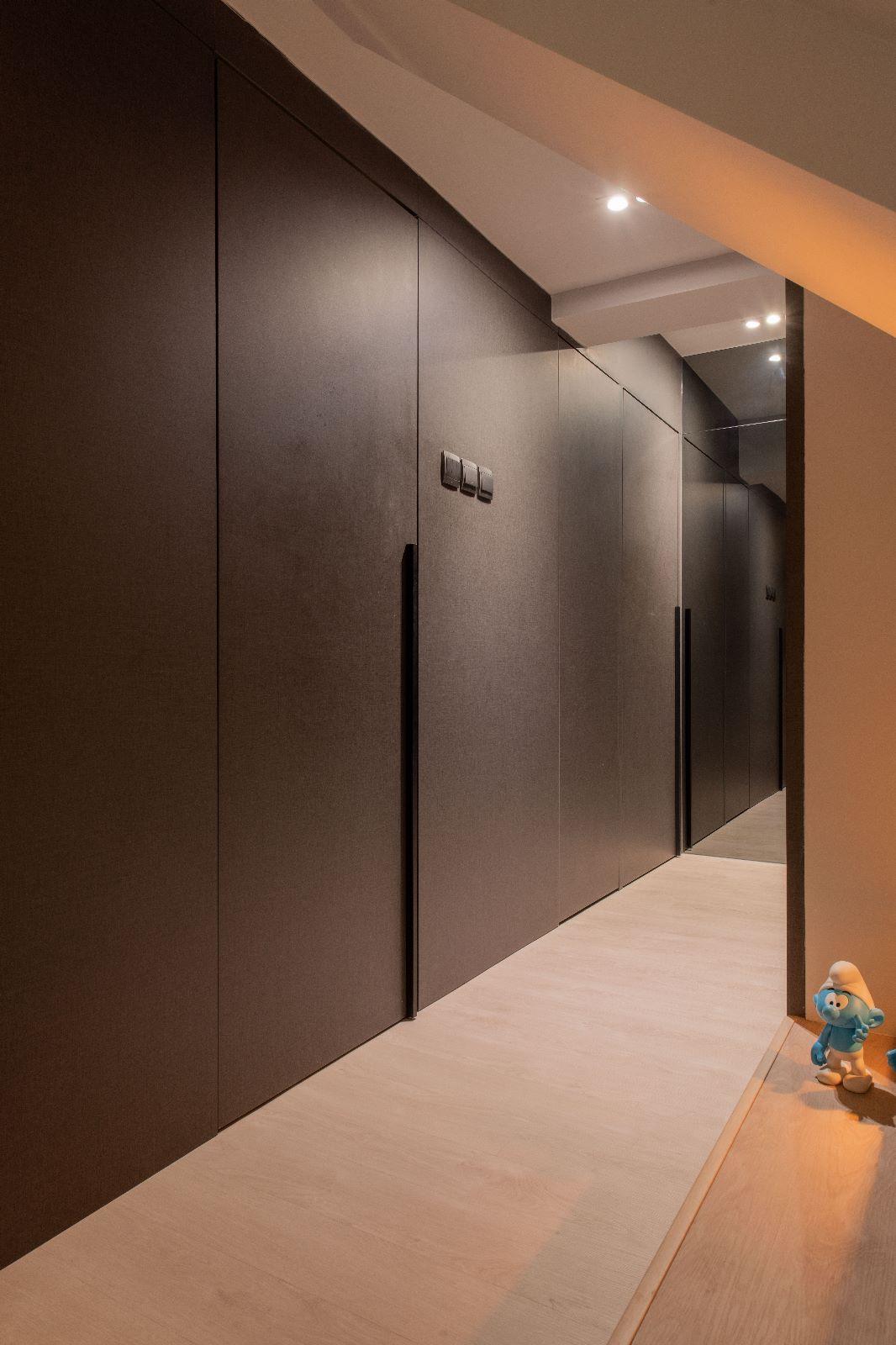 Scandinavian Hallway with Artwork and Storage Cabinets