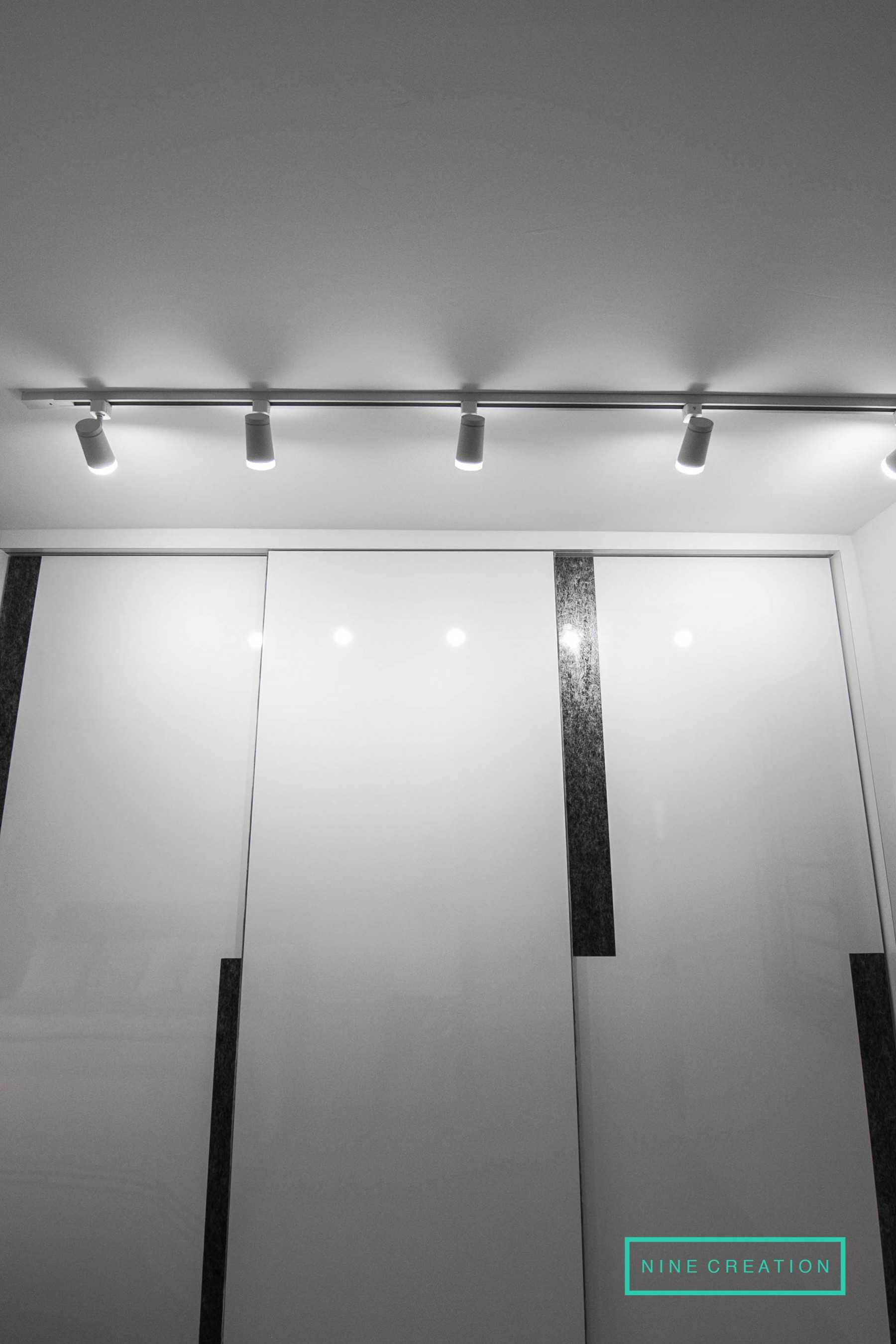 Modern Bedroom with Homogeneous Tiles and Wardrobe