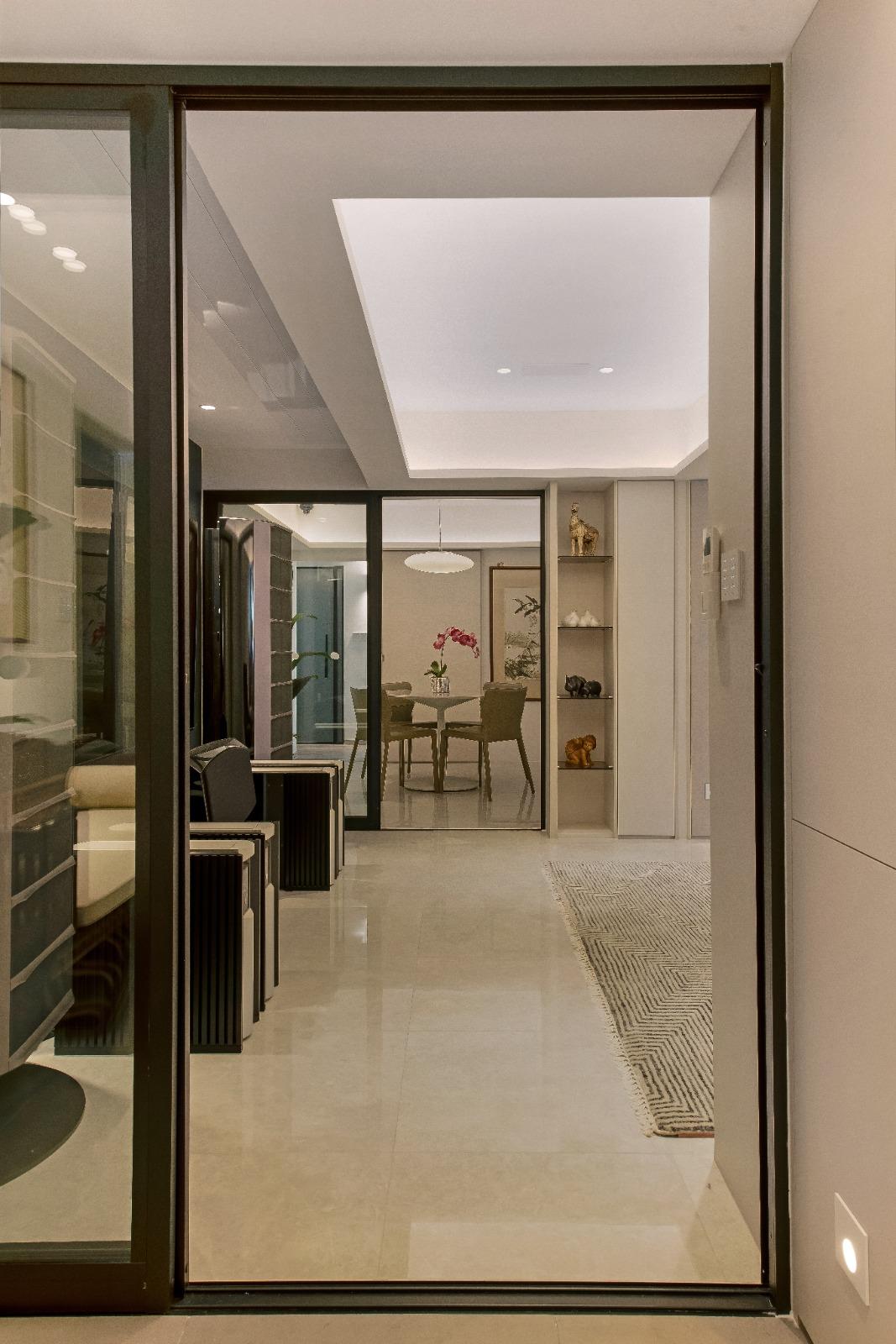 Modern Foyer with Artwork and Glass Door