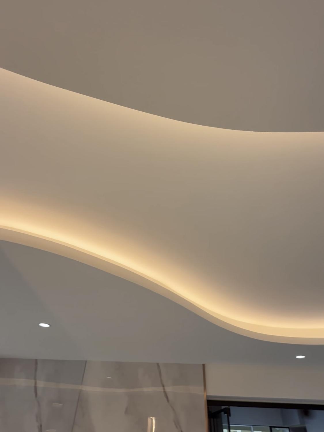 Contemporary Living Room with Cove Lighting and Drop Ceiling
