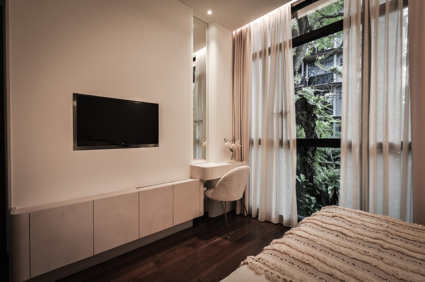 Modern Bedroom with TV and Lighting