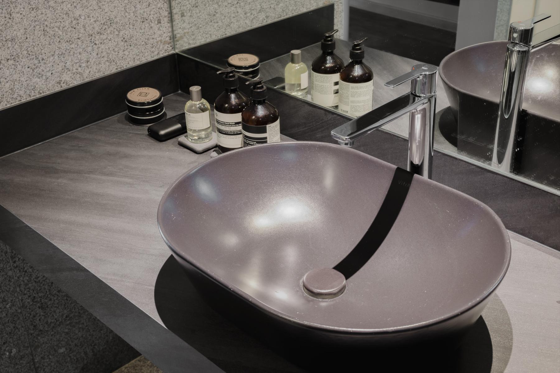 Minimalist Bathroom with Countertop and Mirror