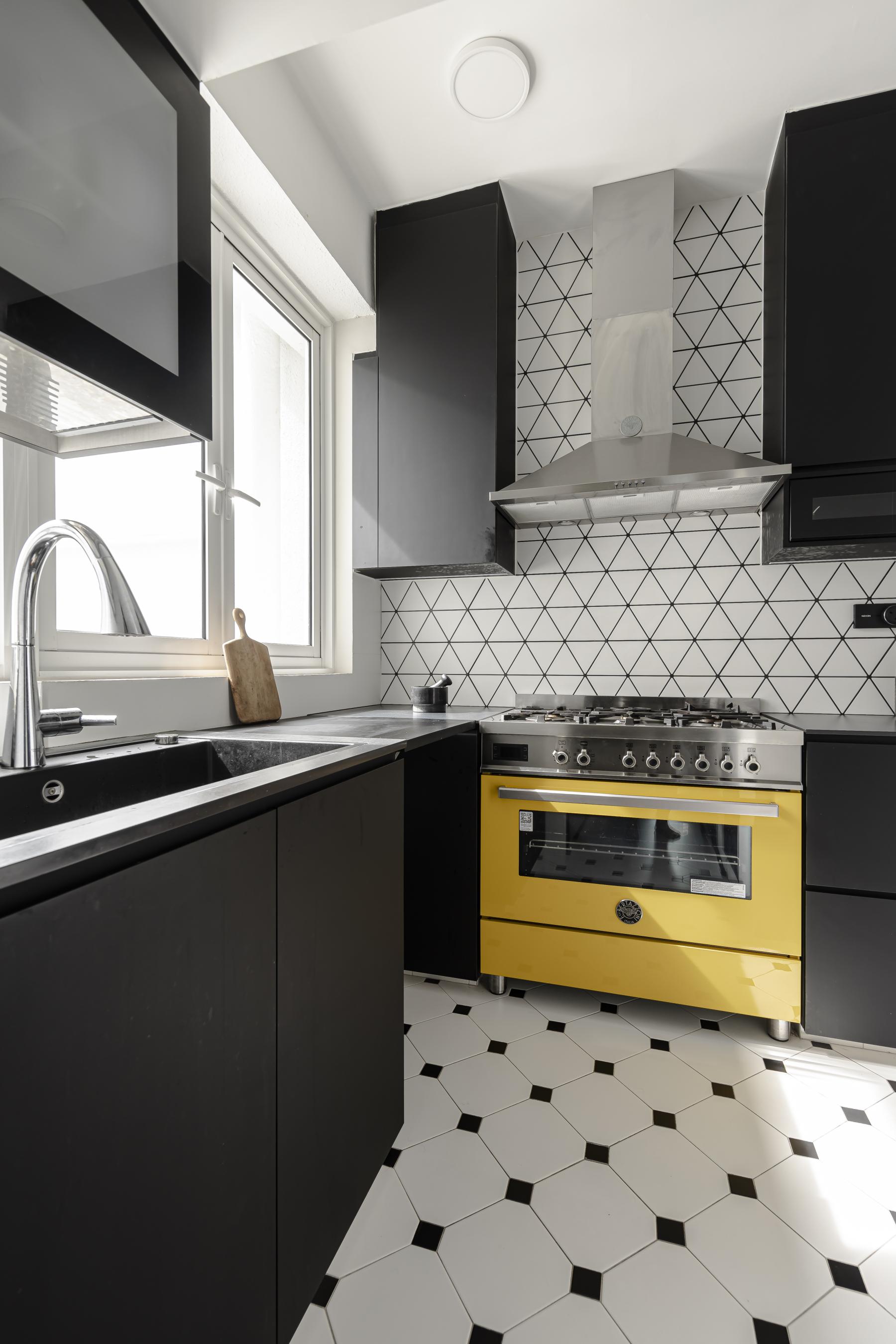 Eclectic Kitchen with Homogeneous Tiles and Kitchen Window