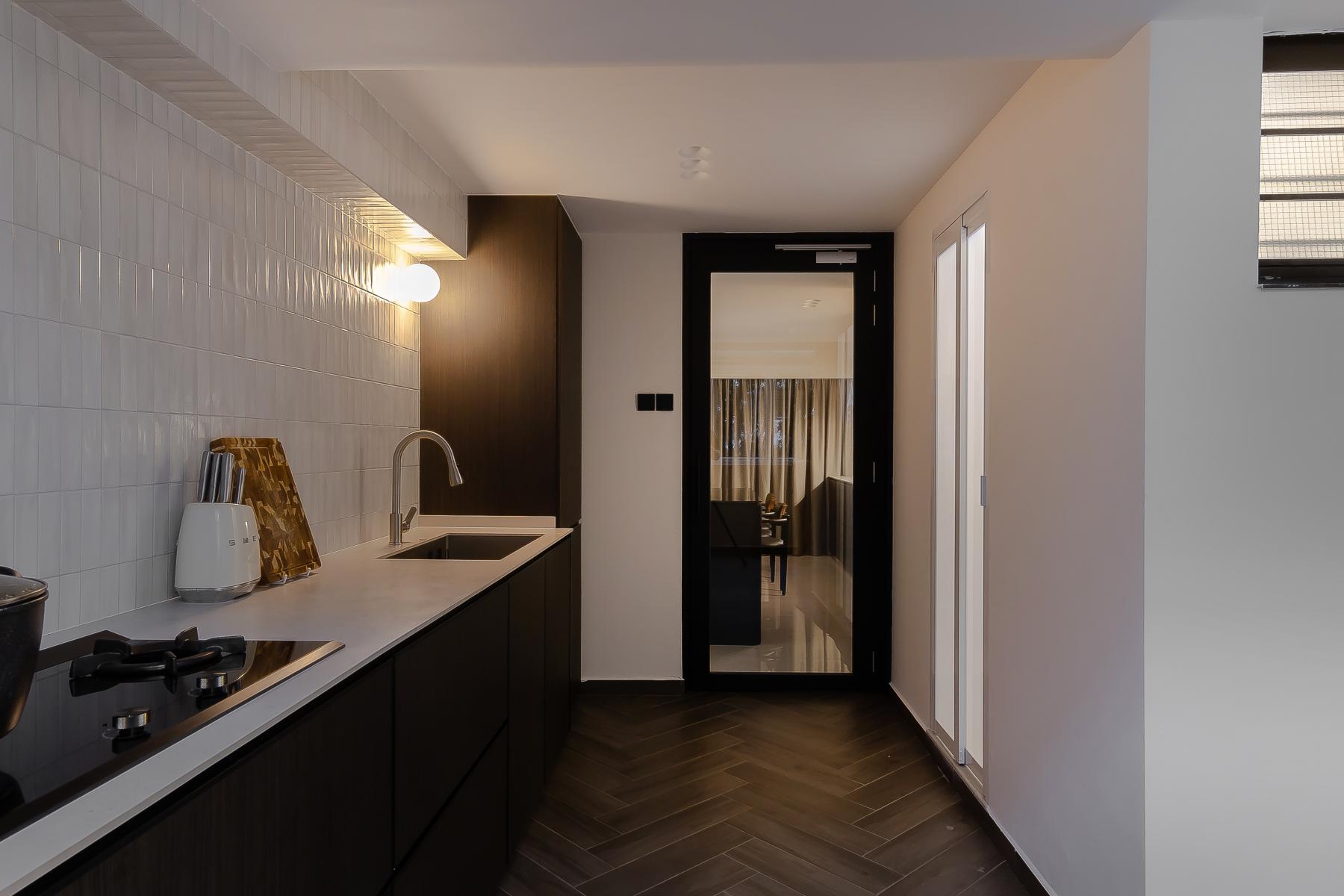 Minimalist Kitchen with Countertop and Herringbone Tiling