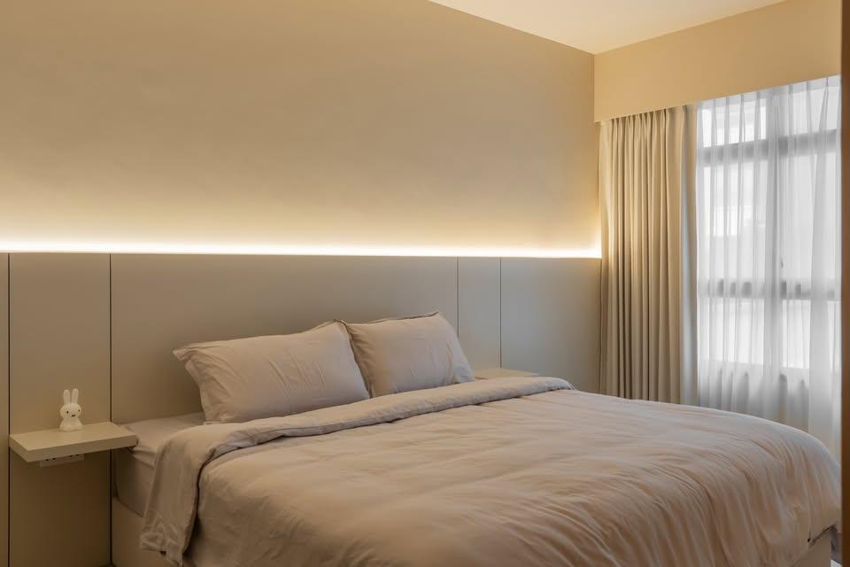 Modern Bedroom with Cove Lighting and Bedside Table