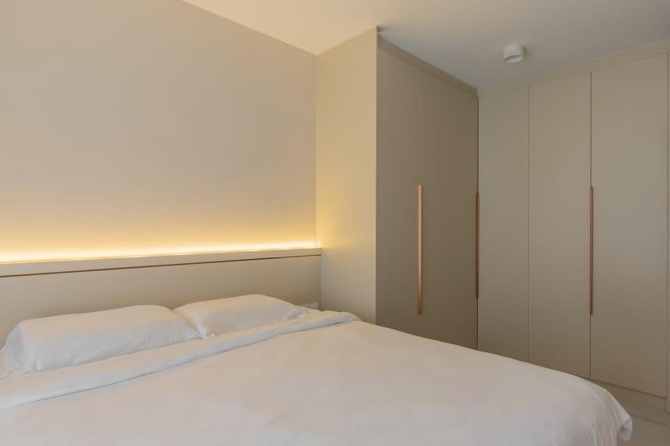 Modern Bedroom with Cove Lighting and Wardrobe