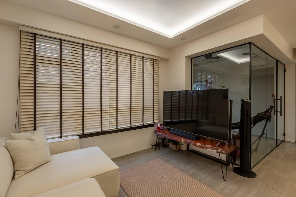 Modern Living Room with Cove Lighting and Carpet