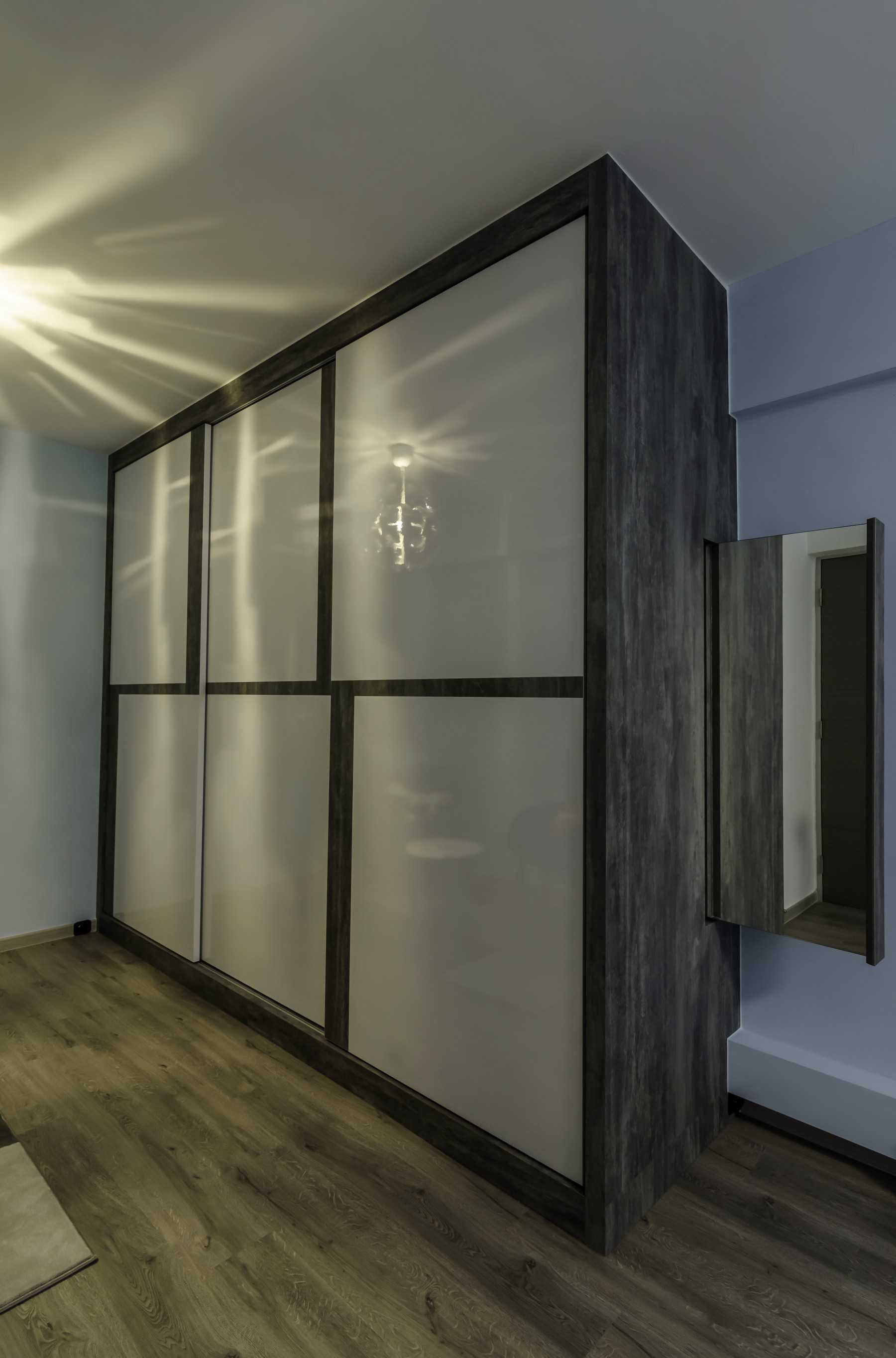 Industrial Bedroom with Vinyl Flooring and Wardrobe