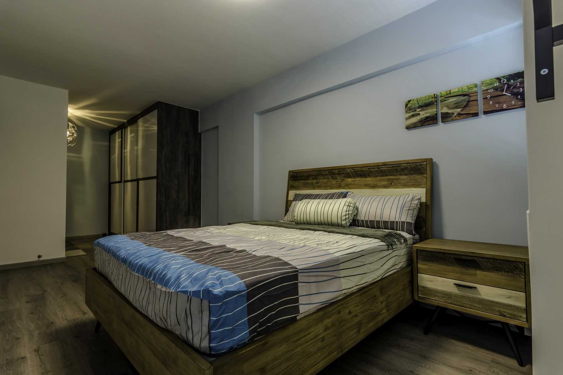 Industrial Bedroom with Vinyl Flooring and Wardrobe