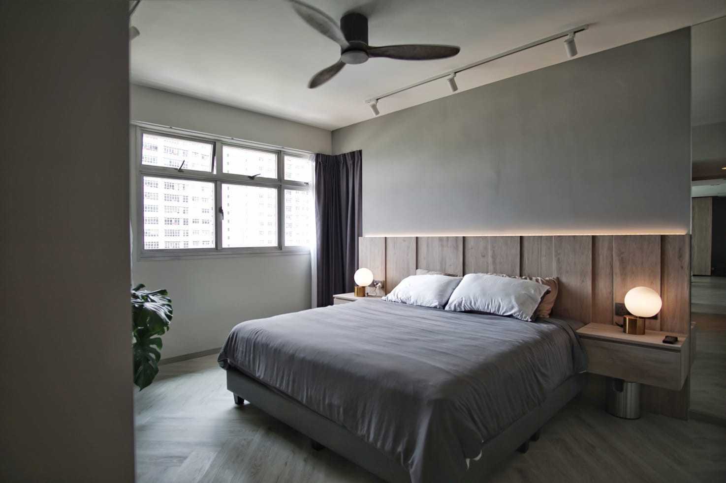 Minimalist Bedroom with Wood Flooring and Cove Lighting