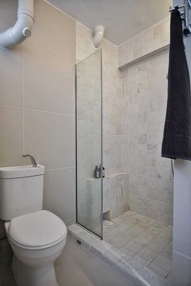 Minimalist Bathroom with Showers and Mixer Shower