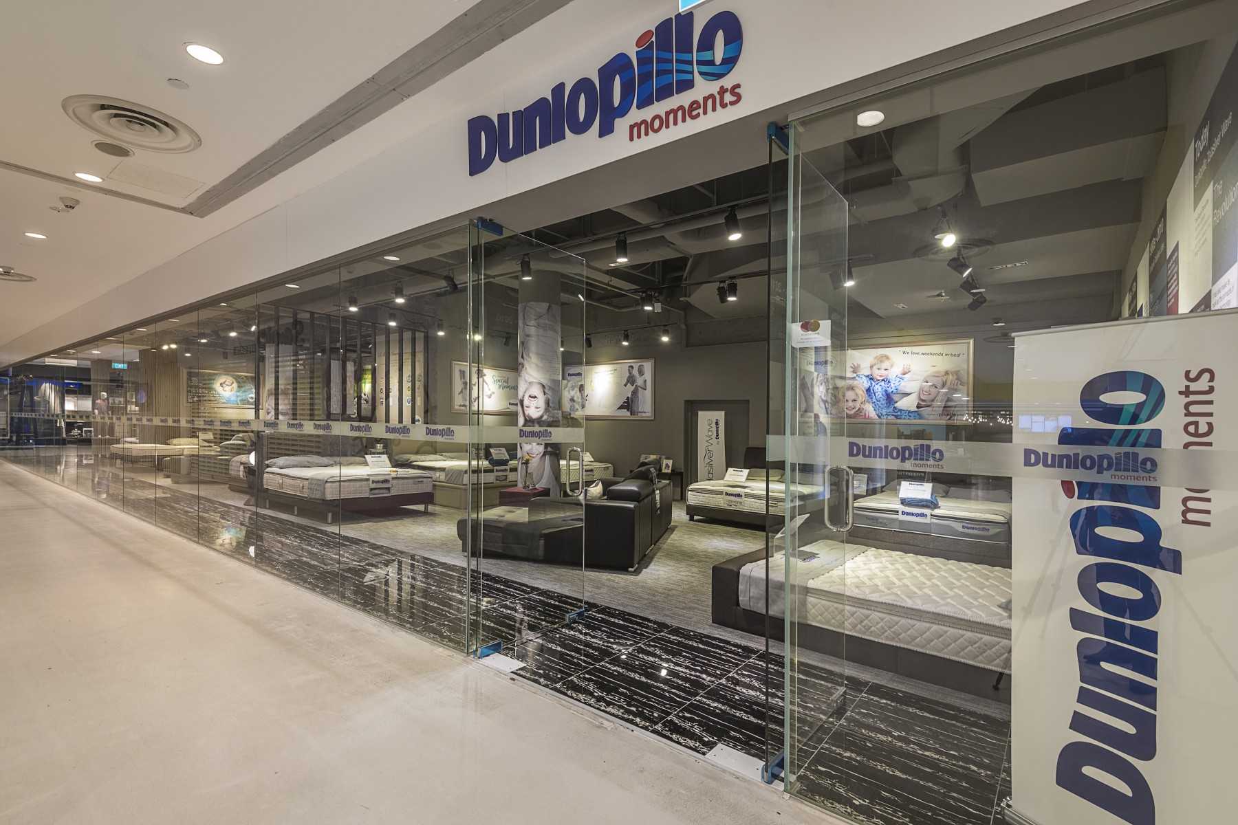 Industrial Shopfront with Homogeneous Tiles and Glass Door