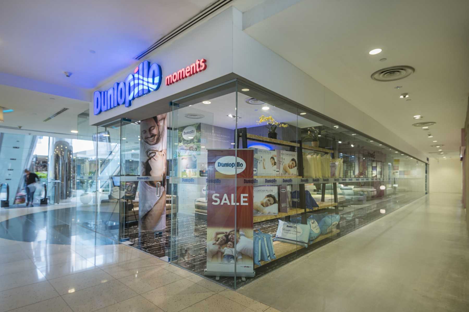 Industrial Shopfront with Homogeneous Tiles and Glass Door