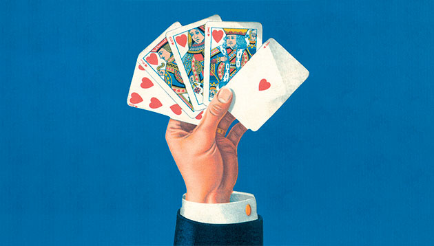 person-holding-playing-cards