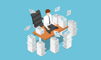 businessman-meditating-on-desk-iStock
