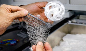 Examples of 3D printed products from the HP Multi Jet Fusion printer, which allows for flexible designs with both soft and hard plastic in a single print.