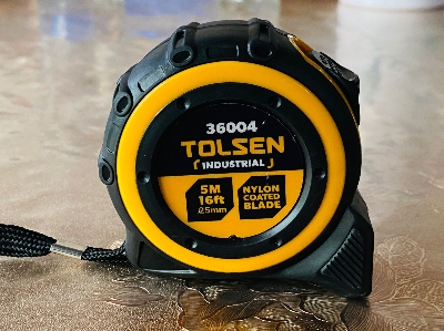 Picture of TOLSEN Measuring Tape 5M/16FT with Nylon Coated Blade Industrial TPR Handle 36004 - Kings Trading